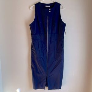 Navy blue stunner-rounded neck with zipper and button accents & pockets so chic.